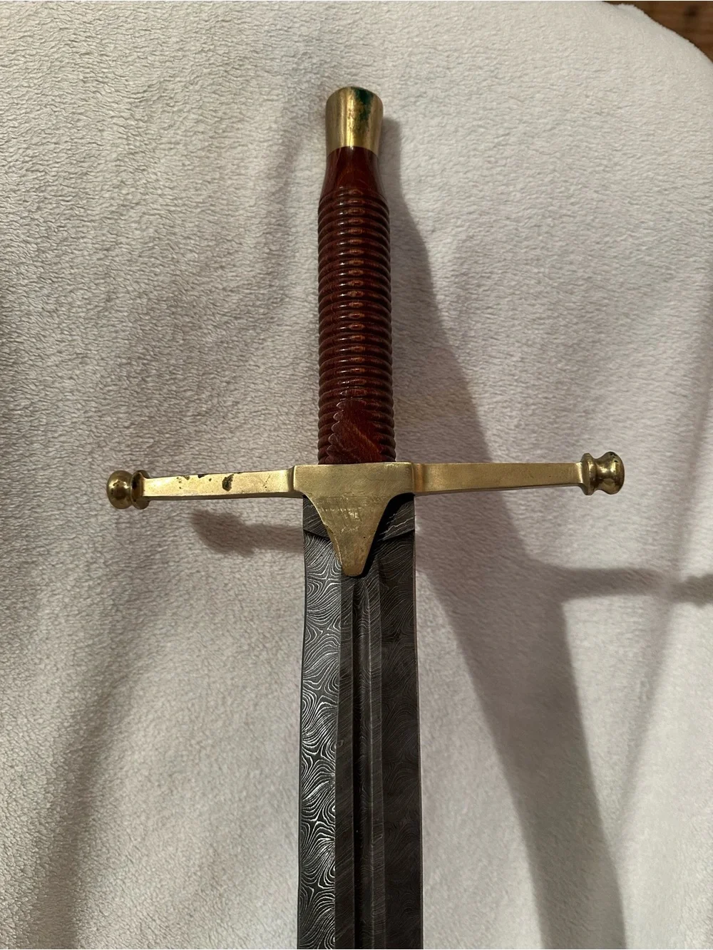 Damascus Rhindon Sword. Comes with yellow sheath.